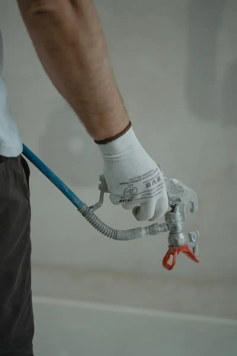 Plumber Holding Silver Faucet