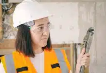 Handywoman Holding a Plumbers Wrench