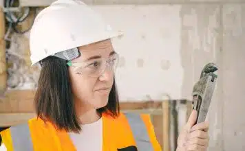 Handywoman Holding a Plumbers Wrench