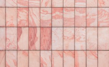 Réussir la pose de carrelage sans joint pour un sol parfait a close up of a pink marble tile wall
